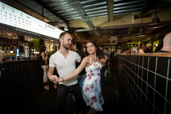 Couple dancing Salsa in a bar salsateca